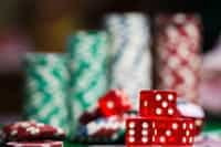 A stack of casino chips and craps dice.