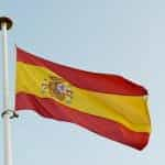 The Spanish flag waves in a flagpole.